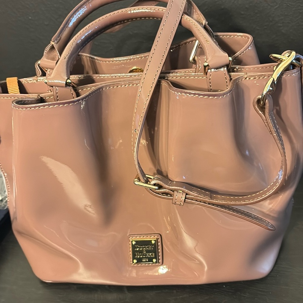 Dooney & Bourke Patent Small Brenna Satchel color is MINK.